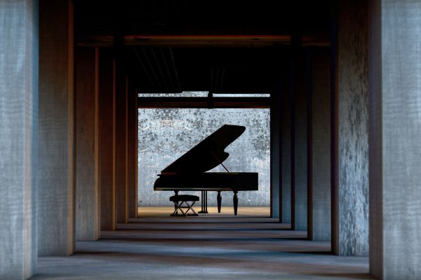 Grand piano in cement and concrete interior architecture. Art and musical instruments.